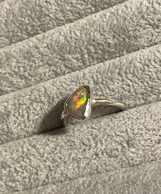 Rolling flash opal ring